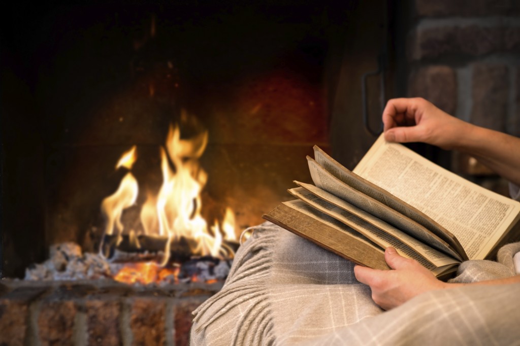 reading book by fireplace iStock_000035340290_Medium
