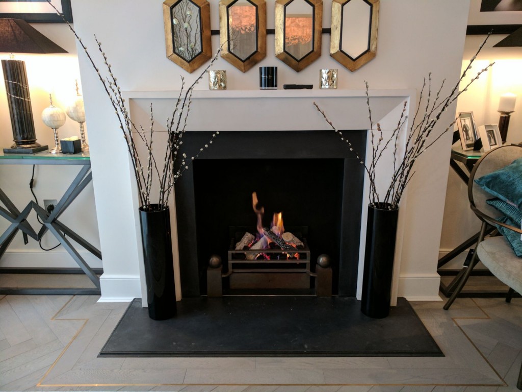 Fireplace surrounded by ornamental pieces