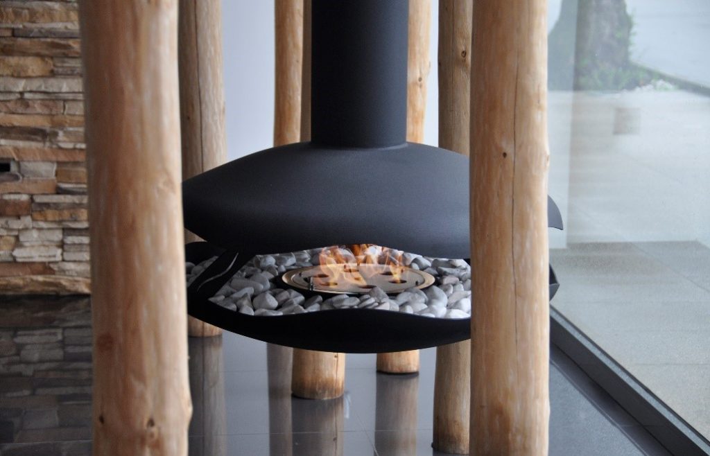 GlammFire Burner inbetween a wooden rustic display