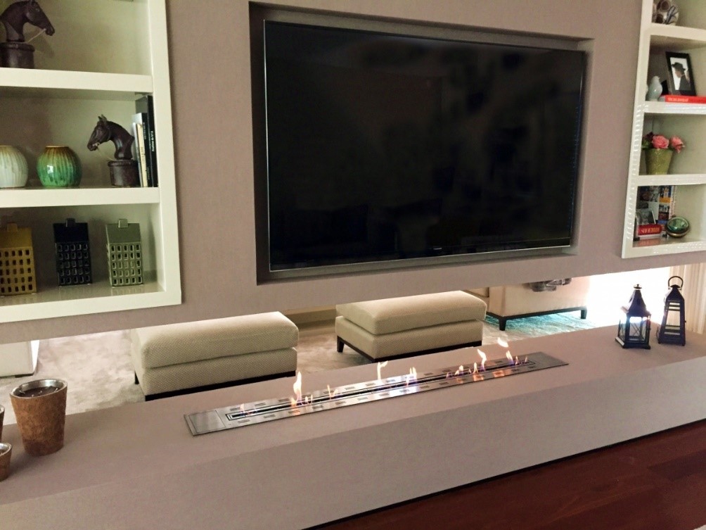 TV Lounge Area With a Partition Displaying a Bioethanol Burner