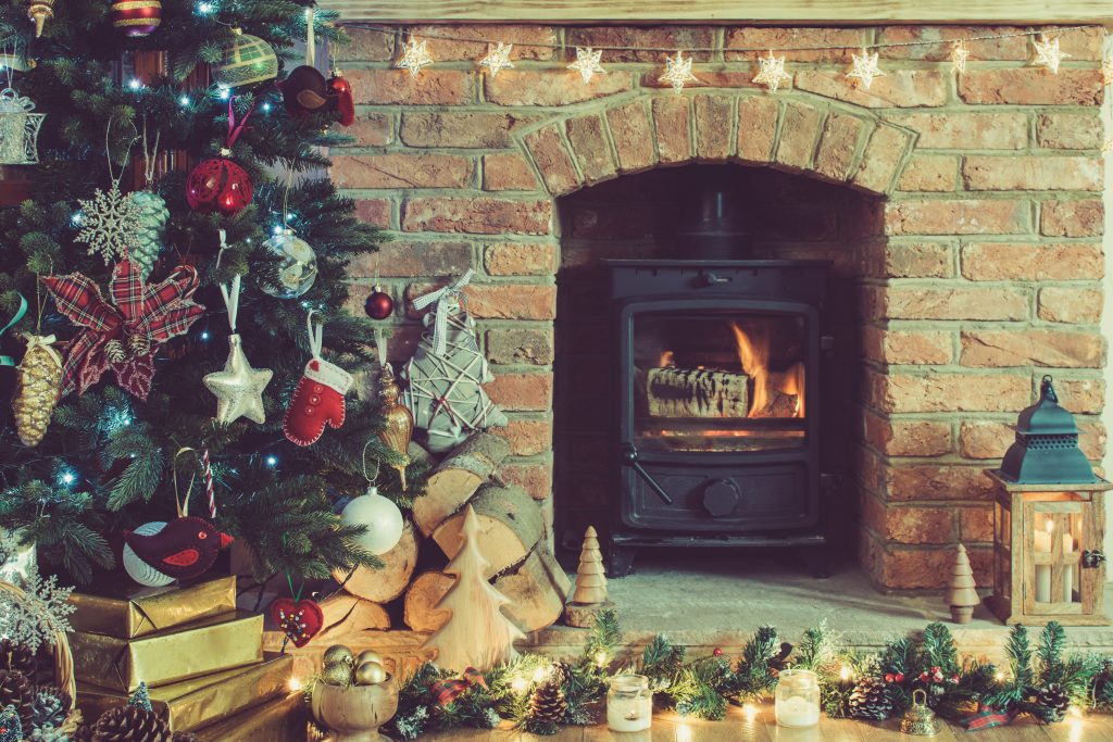 Christmas setting, decorated fireplace, fur tree