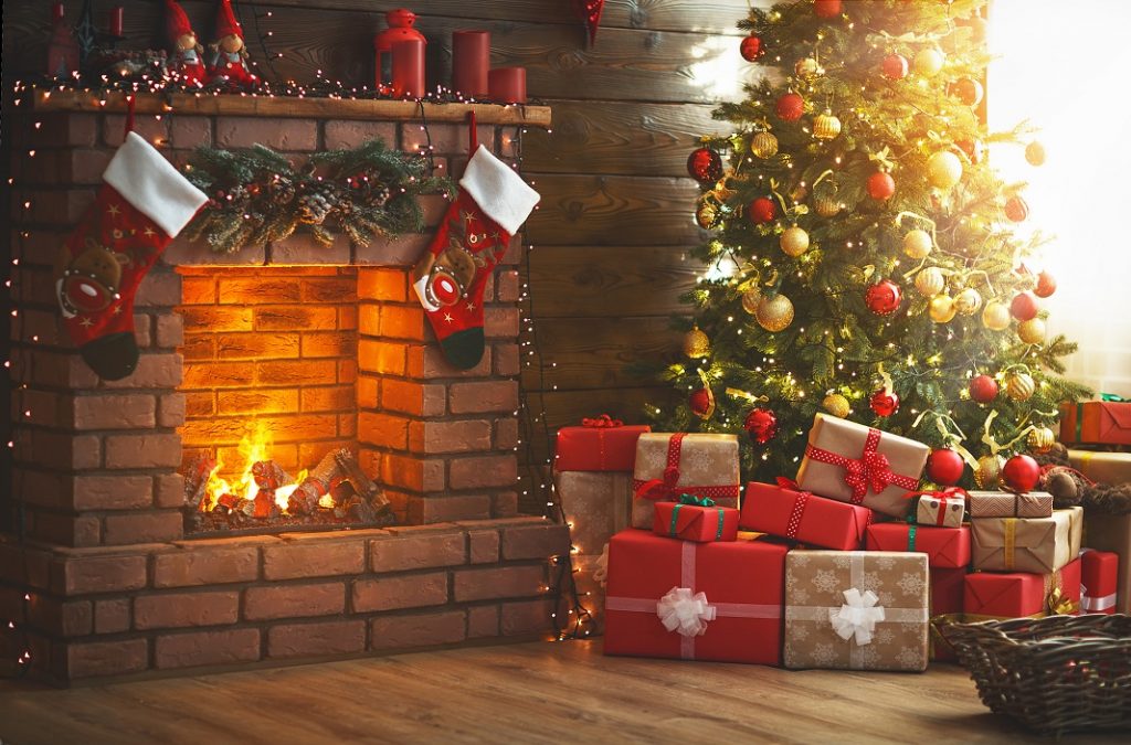 interior christmas. magic glowing tree, fireplace and gifts