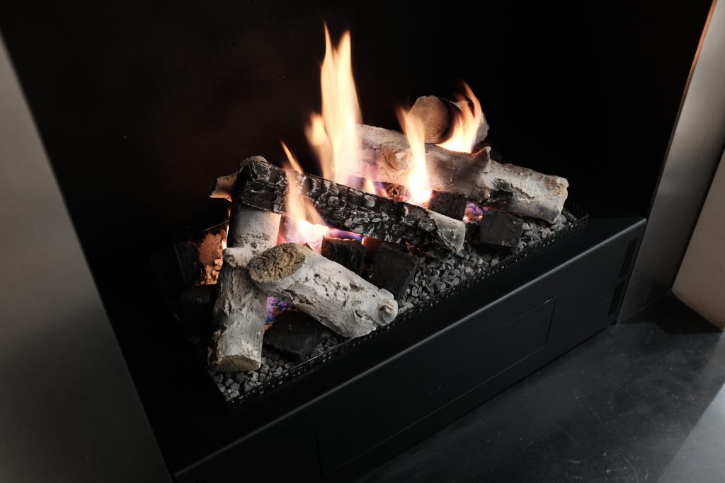 Close up image of a neverdark bioethanol burner with logs