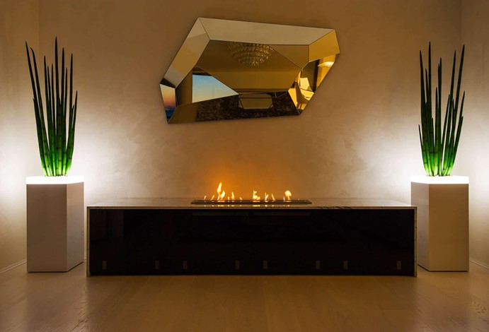 Beautiful modern contemporary fireplace in dramatic entranceway 