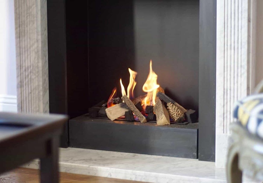 A close-up image of a modern gas fireplace